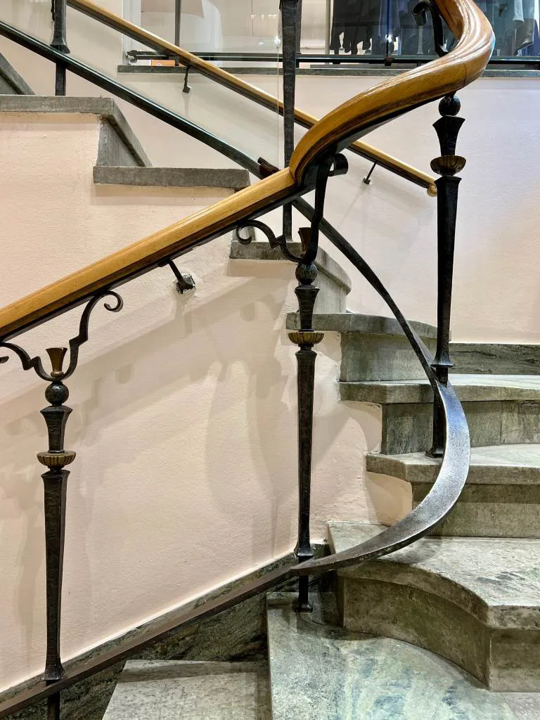 Swedish Grace green stone stairs and cast iron railing