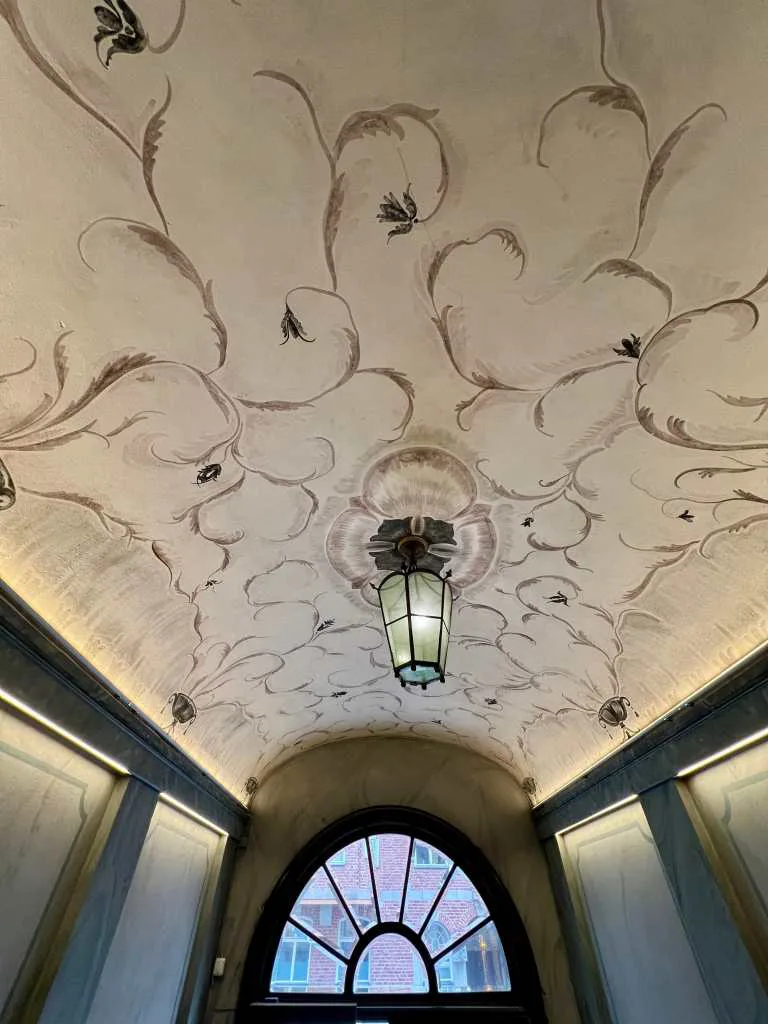 Hall entrance of residential building in Swedish grace style