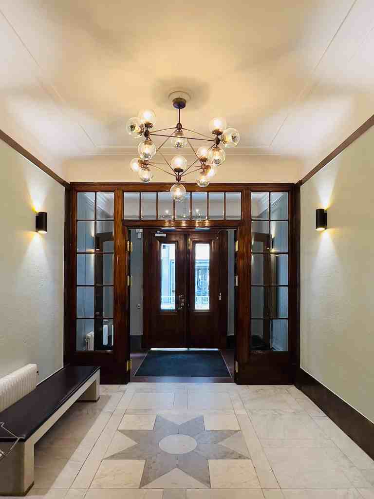 Entry hall wood and marble mosaic floor